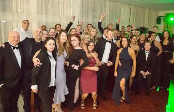 Group of people at a company event representing Evrycard digital business card partnership